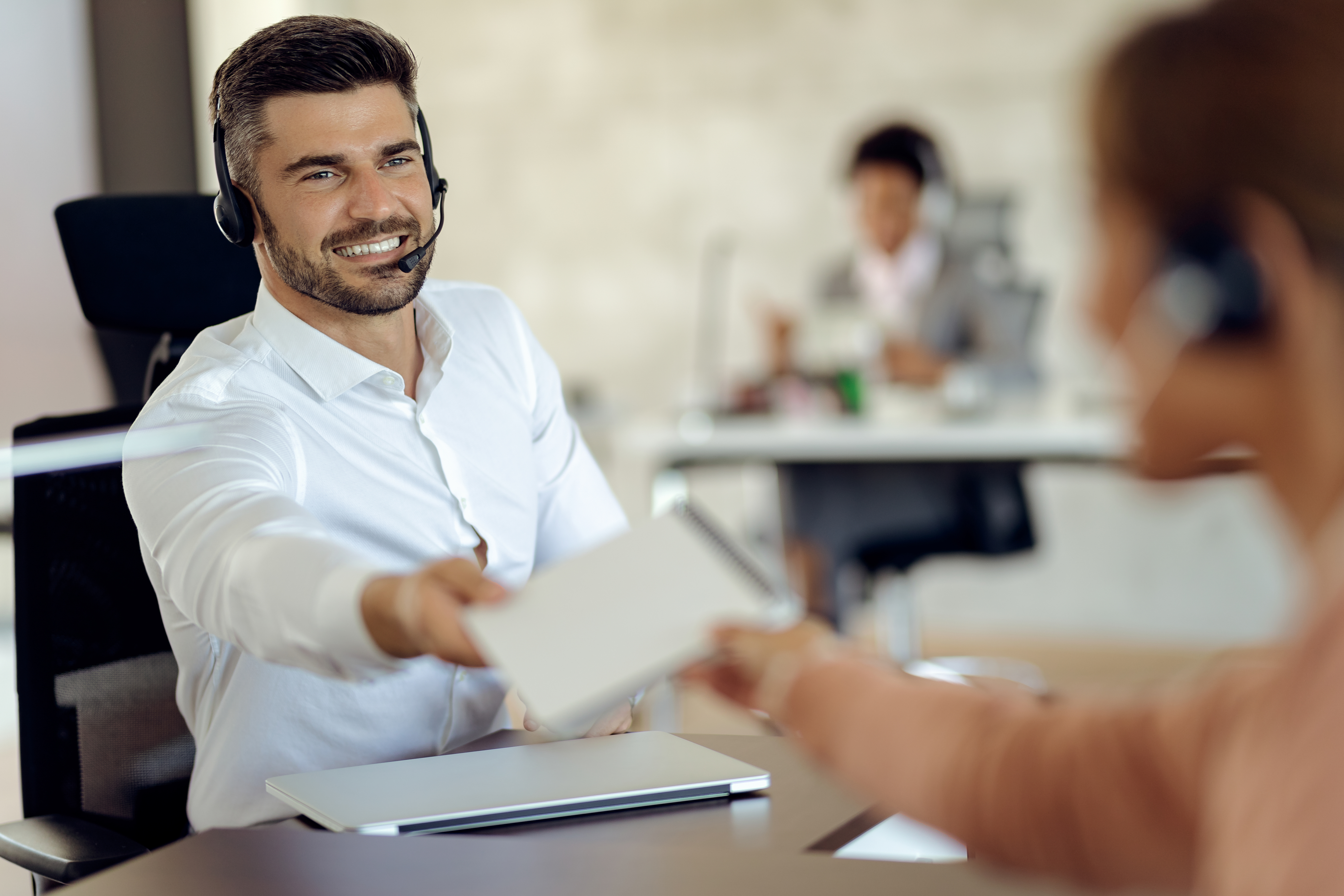 happy-businessman-cooperating-with-his-colleague-while-working-i